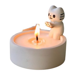 Adorable ceramic cat soy candle with a burning wick